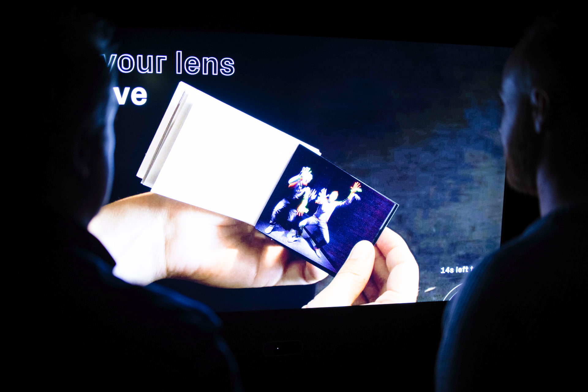 Projection flipbook Hands flicking through a flipbook on a projected screen.