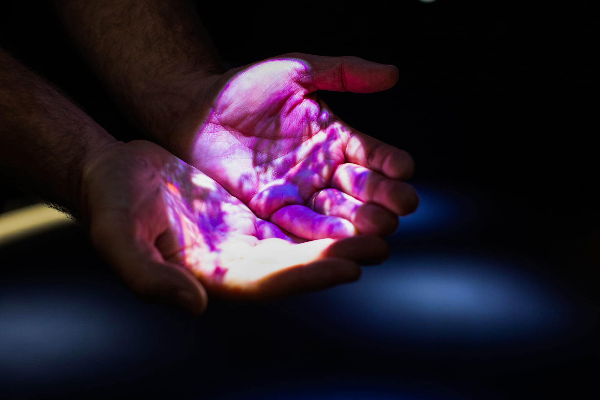 Projection map flipbook Close up of cursive writing projected onto cupped hands.