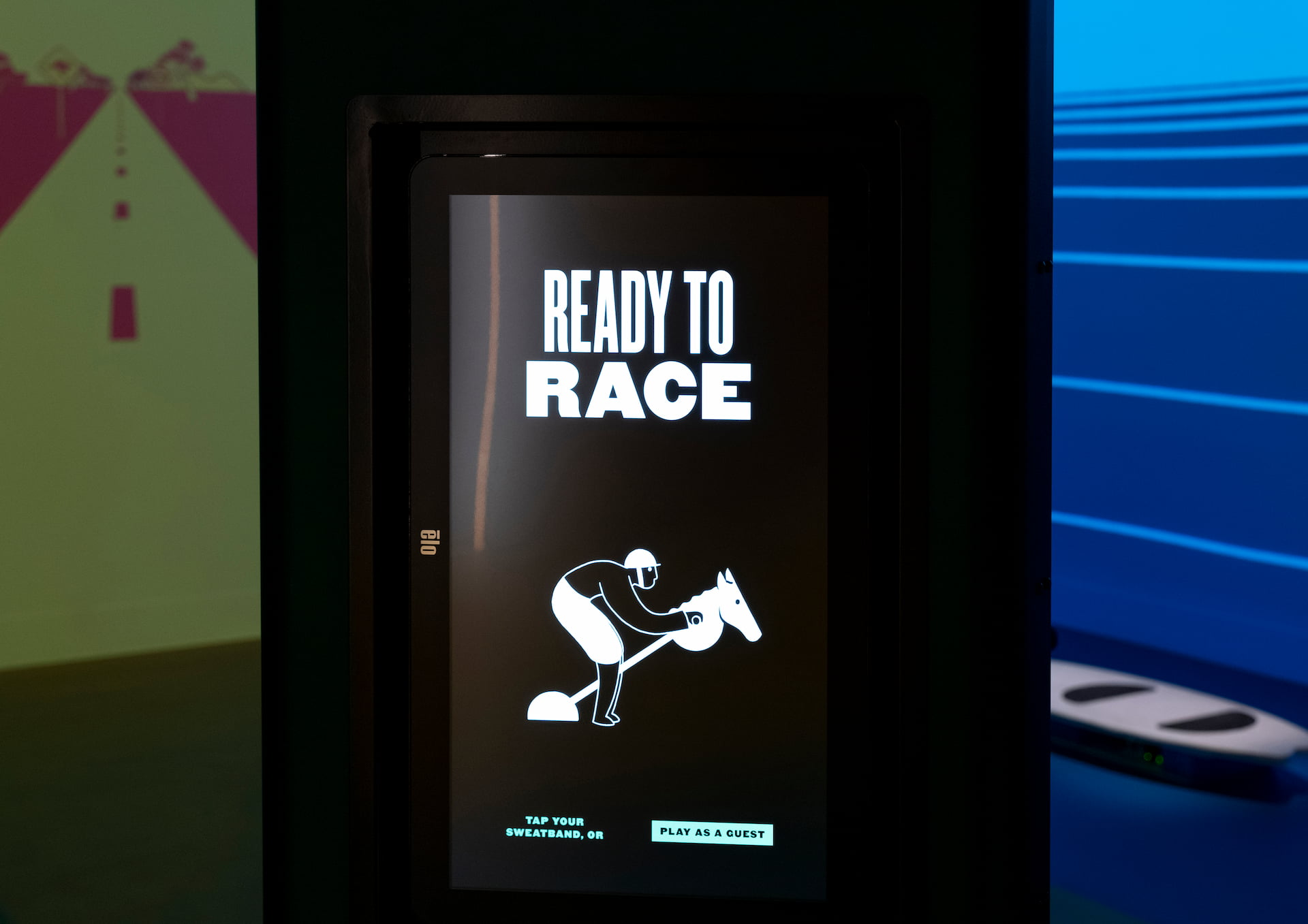 Game-on experience interface Screen reads Ready to Race above a cartoon jockey.