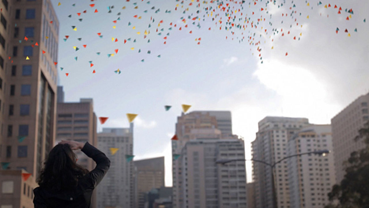 Light installation Flying paper confetti falling from the sky with wishes written on them.