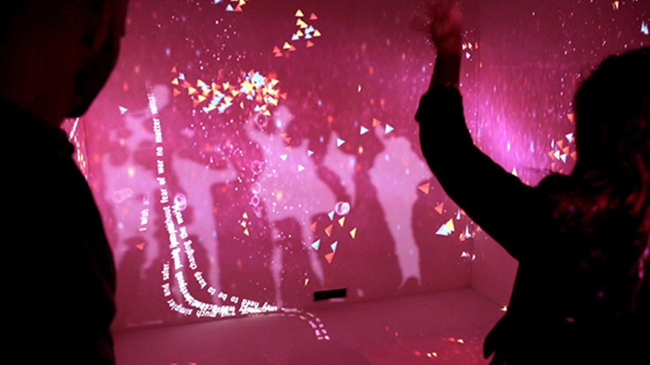 Light installation Full-room projections of confetti and strings of words.