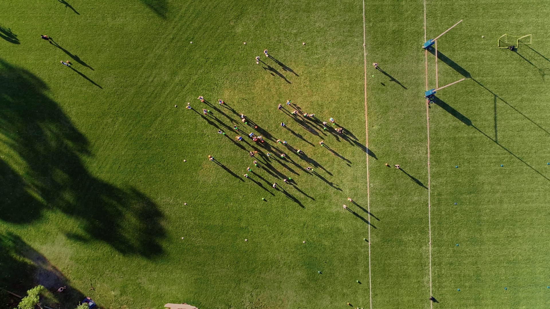 Sports field drone image Aerial top-down shot of people playing on a sporting field.