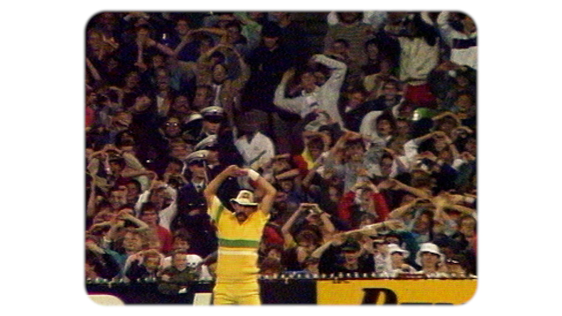 Australian sports stadium Photo of crowd mimicing Merv Hughes stretching.