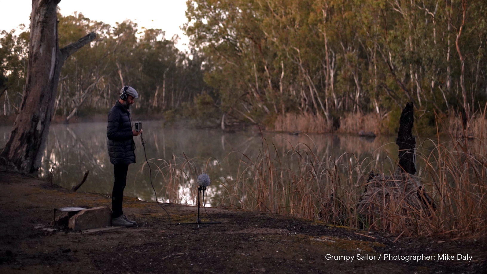 Filming on shoot Man with audio recorder beside the Murray River.