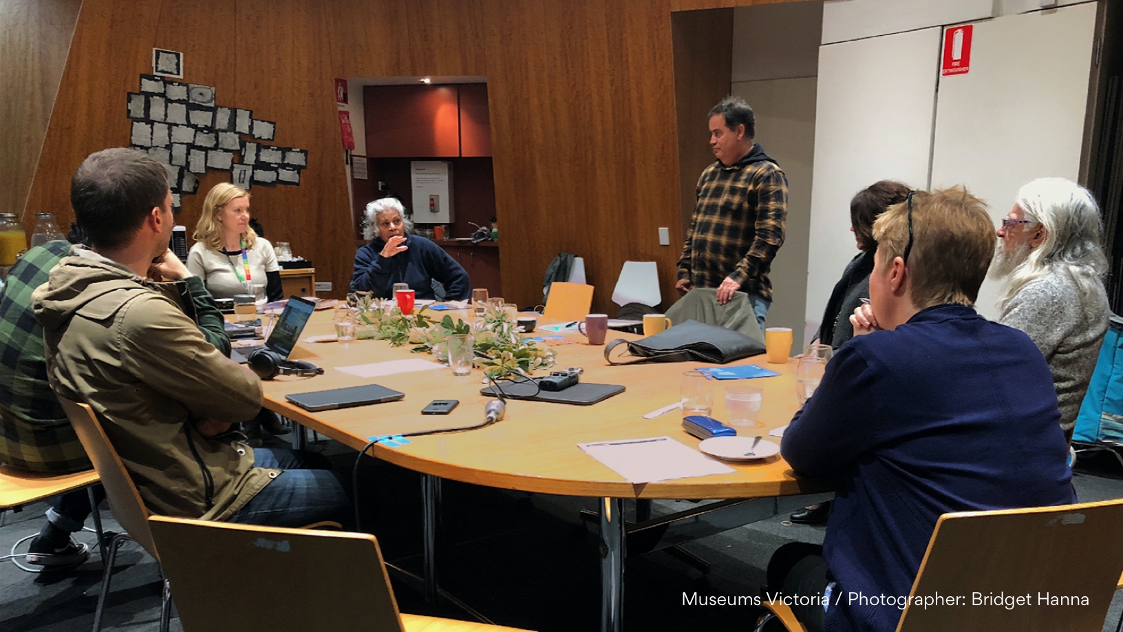 Collaborative workshop Diverse group of people and ethnicities around a conference table.
