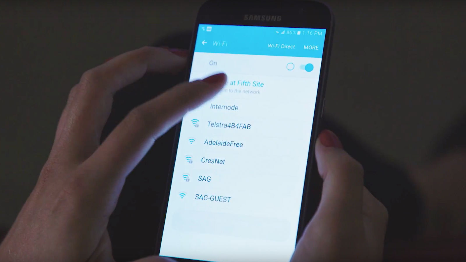 Mobile interactive Fingers selecting the Love At Fifth Site wifi network.