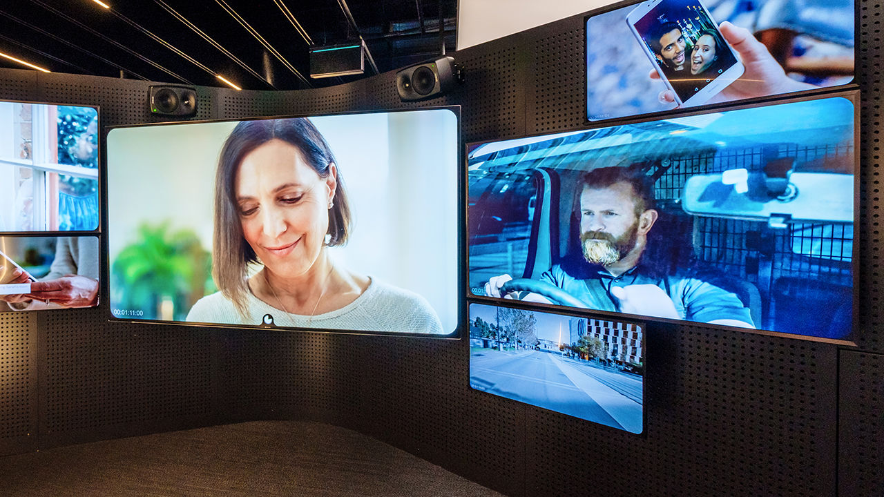 A multitude of different sized screens showing video content.