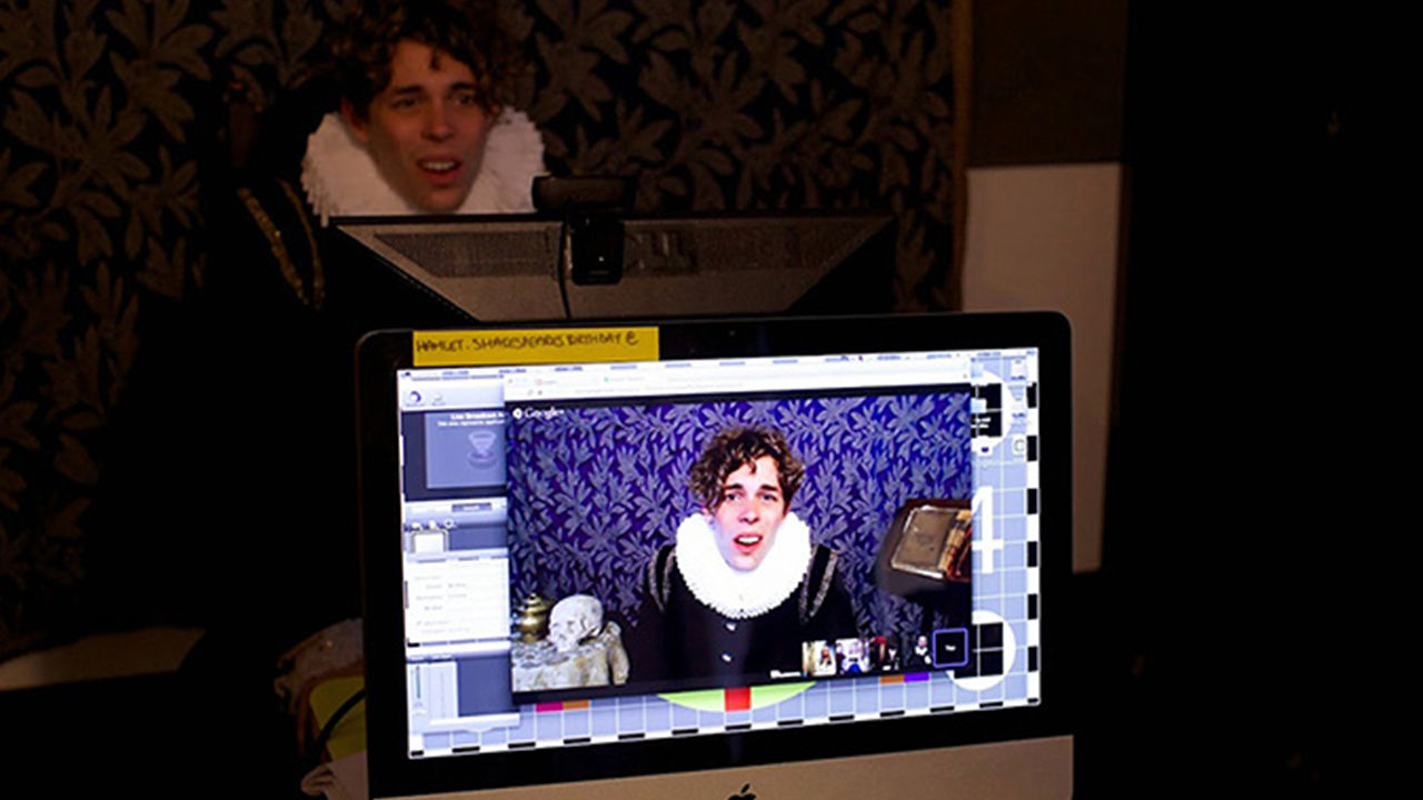 Shakespearean film experience Shakespeare actor on a webcam, video footage played through a laptop in the foreground.