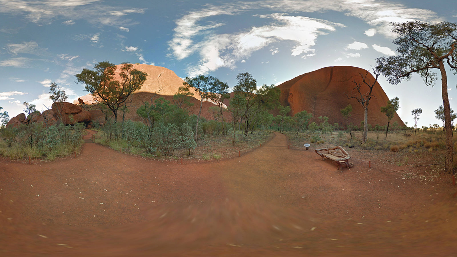 Uluru photoshoot Two dirt paths branching left and right.